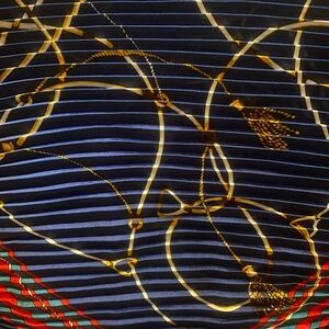 Unique, one of a kind scarf. Pleated. Tassel detail. Red, blue and gold.